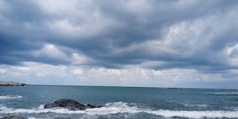 Fototapeta na wymiar Stormy sky over the sea. Panoramic view of stormy sea.