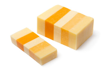 Piece of English Classic Five, Cheddar cheese, and a slice isolated on white background close up