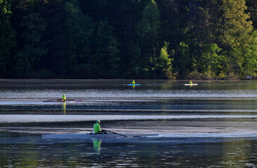 Early morning rowing club on lake