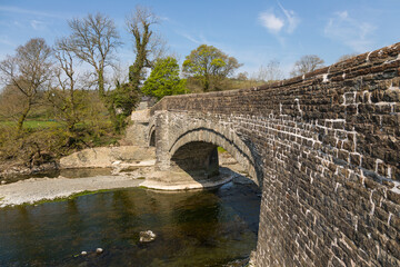 A stone bridge over the Rawthey River in Sedbergh. Yorkshire, UK.