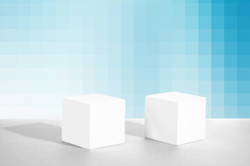 Cosmetic blue pixel gradient background with geometric shapes. Two cement cubic podiums. Mockup for the demonstration of cosmetic products