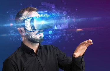 Fototapeta na wymiar Businessman looking through VR glasses