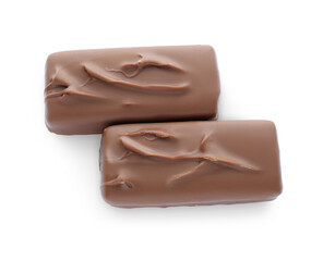 Tasty chocolate bars on white background, top view