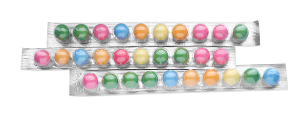 Packages with many bright gumballs isolated on white, top view