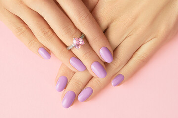 Womans hands with fashionable lavender manicure. Spring summer nail design © Darya Lavinskaya