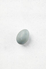 Fototapeta na wymiar Egg dyed with natural dyes on a gray background. Easter celebration concept