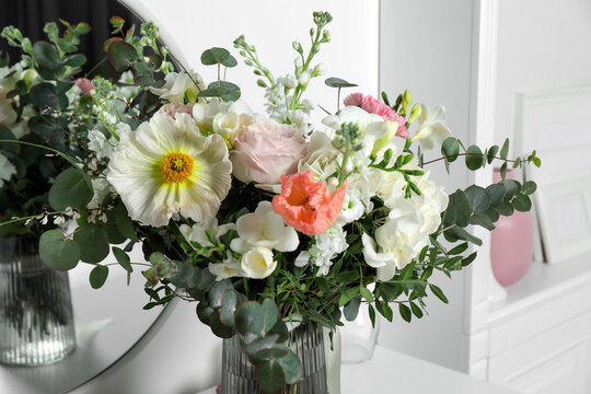 Bouquet of beautiful flowers in vase indoors, closeup