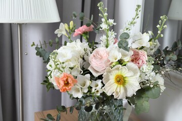 Beautiful bouquet of different fresh flowers indoors, closeup