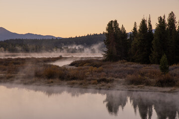 Beautiful Sunrise Landscape Reflection in the Tetons in Autumn