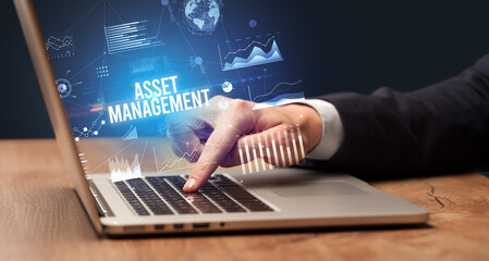 Businessman working on laptop, business concept