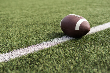 American football rugby ball on the court.