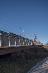 Walk path ramp at a train bridge, sunny spring day in Stockholm