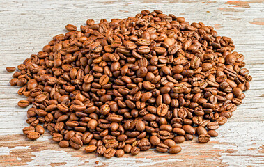 A pile coffee beans on a table