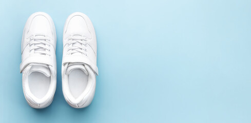 White sneakers on a blue background.