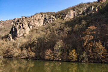 Rock formation above the Nahe River in Bad Munster, Germany on a sunny winter day.
