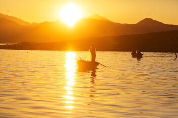 Fototapeta premium Fisherman on sunrise