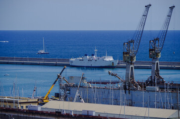 Fototapeta premium Passenger pax cargo car roro ro-ro ferry boat vessel cruiseship cruise ship liner in Palermo Sicily, Italy port with blue sky