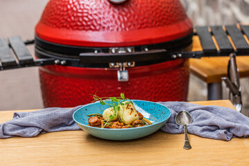 Hungarian goulash with a bread dumpling prepared on the grill. Close up