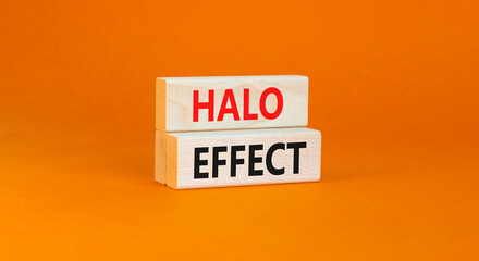 Halo effect and psychological symbol. Concept words Halo effect on beautiful wooden block. Beautiful orange table orange background. Business psychological and Halo effect concept. Copy space.