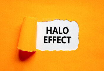 Halo effect and psychological symbol. Concept words Halo effect on beautiful white paper. Beautiful orange table orange background. Business psychological and Halo effect concept. Copy space.