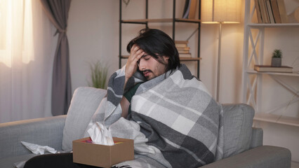 Sick man. Flu disease. Fever headache. Unwell ill guy in warm plaid suffering from high temperature...