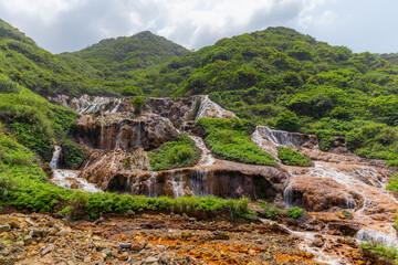 Fototapeta na wymiar Jinguashi golden waterfall in New Taipei city of Taiwan