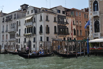 Fototapeta na wymiar a magical Venetian street with tiny houses and canals with the sea
