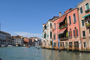 Fototapeta na wymiar a magical Venetian street with tiny houses and canals with the sea