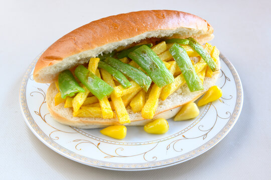 Close-up shot of Izmir's famous Turkish Traditional Kumru Sandwich, Ceşme Kumru, patso ingredients ready to eat salami, soudjouk, tomato, cheddar cheese and fried cheese. Yengen sandvic.
