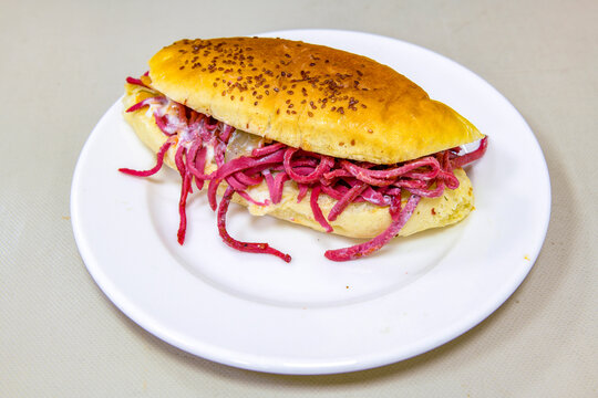 Close-up shot of Izmir's famous Turkish Traditional Kumru Sandwich, &Ccedil;eşme Kumru , ingredients ready to eat salami, sucuk , tomato, cheddar cheese and fried cheese. Yengen eritme karisik sandvic.