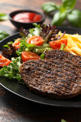 Peppered Vegetarian steaks served with french fries and salad