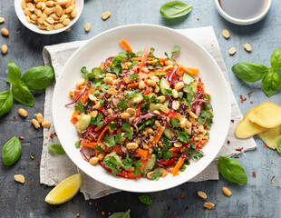 Asian Quinoa salad with fresh vegetables, peanuts and herbs. Healthy food.