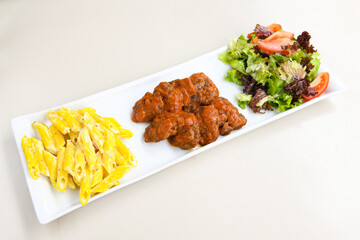 Fried Chicken breast hot crispy strips crunchy chicken tenders  isolated on white background.Nuggets isolated on white background on a plate