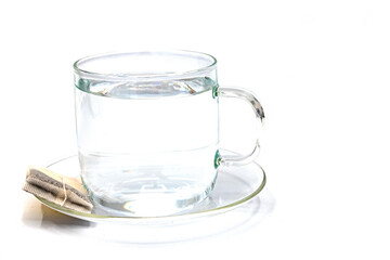 Cup of tea and mint with limon on a white background. Broown sugar