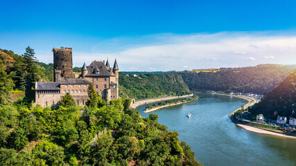 Katz castle and romantic Rhine in summer at sunset, Germany. Katz Castle or Burg Katz is a castle ruin above the St. Goarshausen town in Rhineland-Palatinate region, Germany - obrazy, fototapety, plakaty