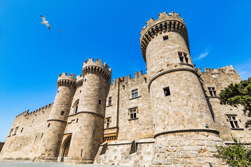 The Palace of the Grand Master of the Knights of Rhodes, Greece. Famous Knights Grand Master Palace (also known as Castello) in the Medieval town of Rhodes, Greece. - obrazy, fototapety, plakaty