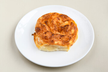Turkish style meat stuffed filo dough borek served kol boregi. Cheese and minced pie are sliced on a marble background. Turkish name: Kol Boregi, ispanakli, kiymali, Su Boregi