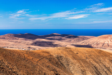 Fototapeta na wymiar Betancuria National Park on the Fuerteventura Island, Canary Islands, Spain. Spectacular view of the picturesque mountain landscape from the drone of the Betancuria National Park in Fuerteventura