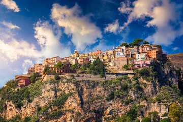 Fototapeta na wymiar Castelmola: typical sicilian village perched on a mountain, close to Taormina. Messina province, Sicily, Italy. Castelmola town on rocky mountain top in Sicily, Italy.