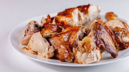 Sliced fried chicken on a white plate