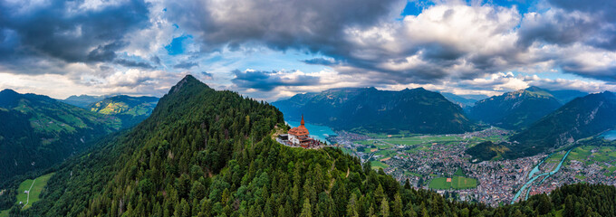 Beautiful top of Harder Kulm in Swiss Interlaken in summer sunset. Turquoise Lake Thun and Brienz...