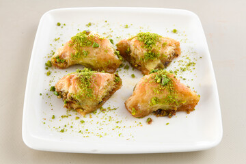 Turkish Dessert Sobiyet Baklava, mussels baklava and classic baklava with Pistachio . Didye, Cevizli, Fistikli Baklava, top view.