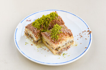 Turkish Dessert Sobiyet Baklava, mussels baklava and classic baklava with Pistachio . Didye, Cevizli, Fistikli Baklava, top view.