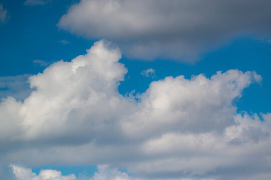 Blue sky background with clouds © sezer66