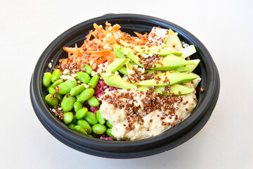 Green salad with arugula, lamb and tomatoes. Healthy vegan dish. Top view at table. Turkish Coban (choban) salata or Shepherds salad, Akdeniz salad in white bowl.