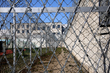 Prison. Prison wall with barbed wire. law and justice