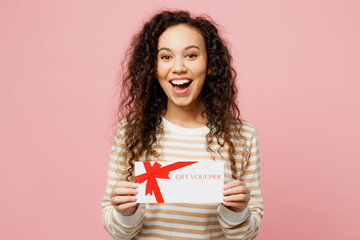 Young surprised shocked woman of African American ethnicity she wear light casual clothes hold gift...