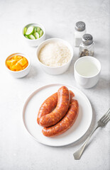 Raw uncooked sausages Chorizo in a plate