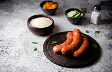 Raw uncooked sausages Chorizo in a plate