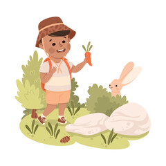 Cute Boy with Backpack Hiking and Feeding Rabbit with Carrot Vector Illustration